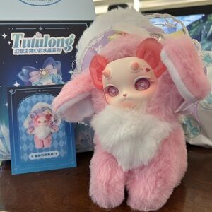 a Tutulong cat  dragon fantasy creature